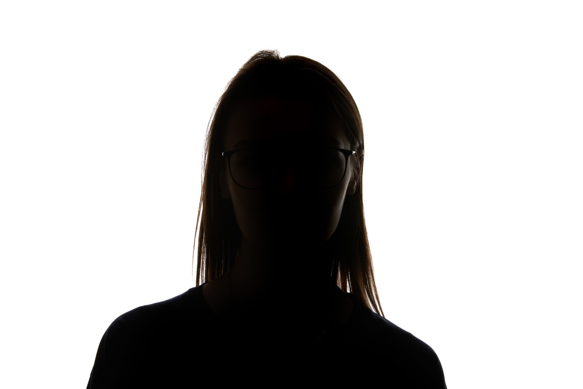Silhouette of woman in glasses looking at camera isolated on white